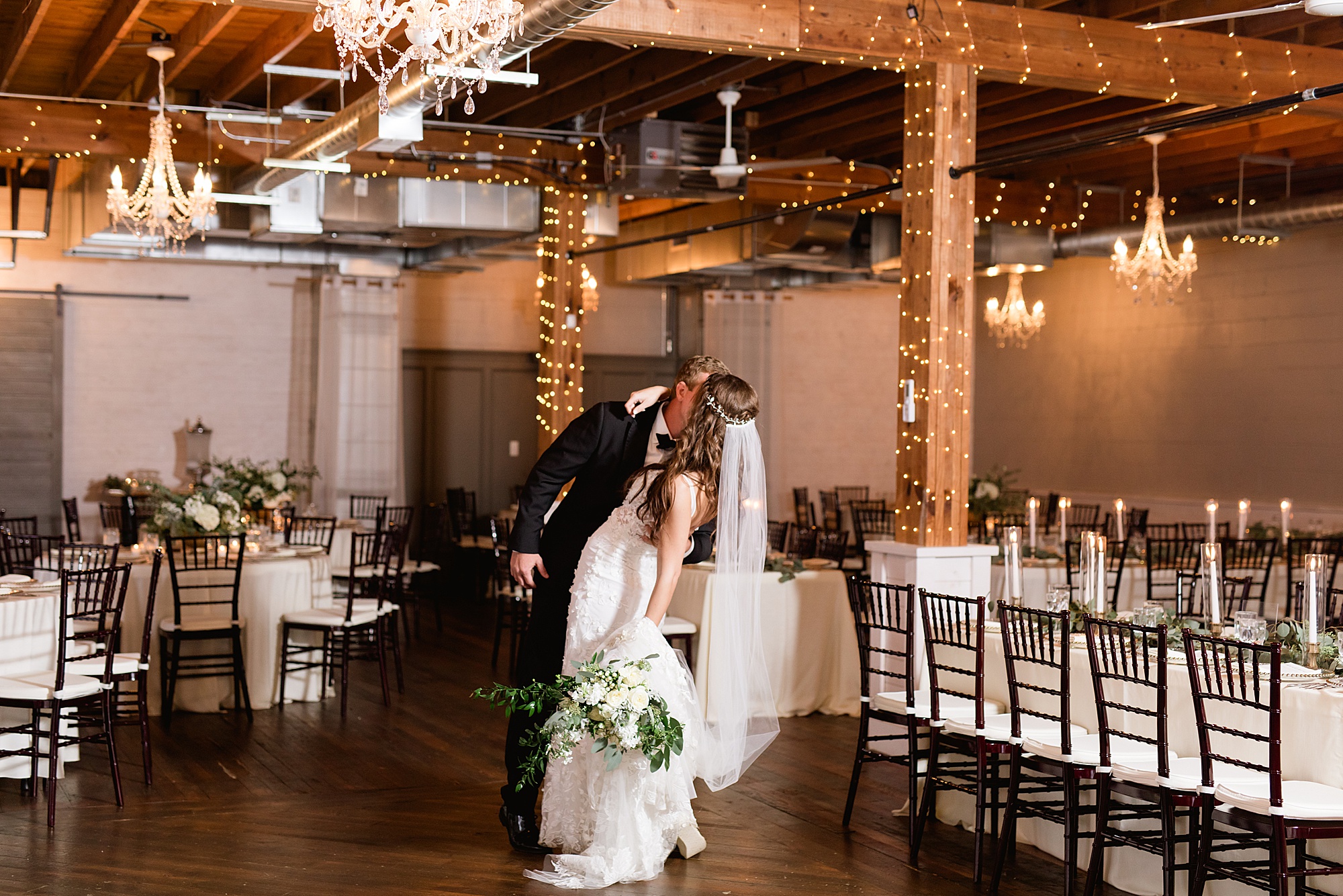 A romantic French blue, ivory, and green Holly Vault wedding in Downtown Holly, Michigan by Breanne Rochelle Photography.