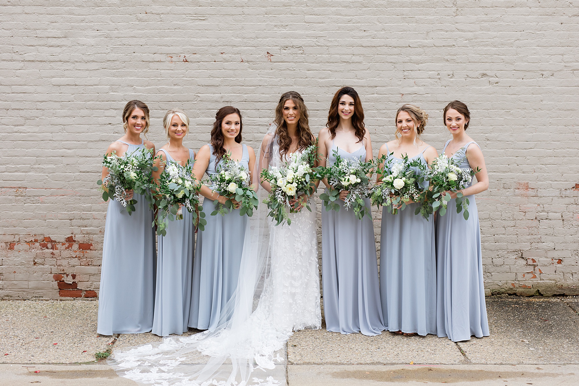 A romantic French blue, ivory, and green Holly Vault wedding in Downtown Holly, Michigan by Breanne Rochelle Photography.