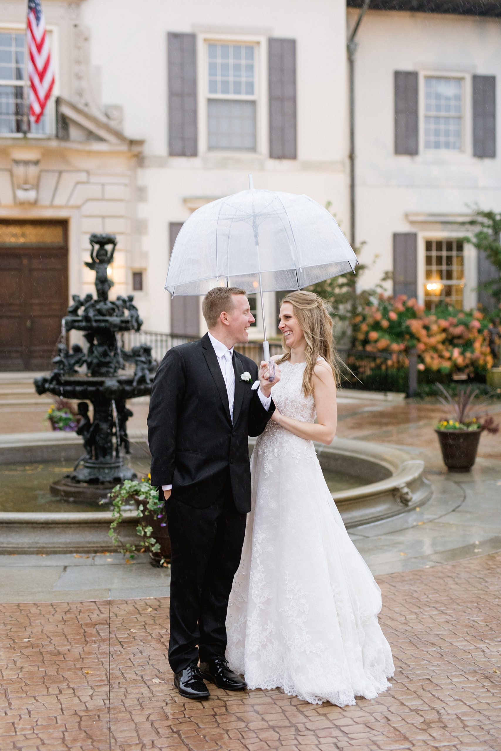 A classic rainy Grosse Pointe War Memorial wedding in late October filled with greenery and roses by Breanne Rochelle Photography.