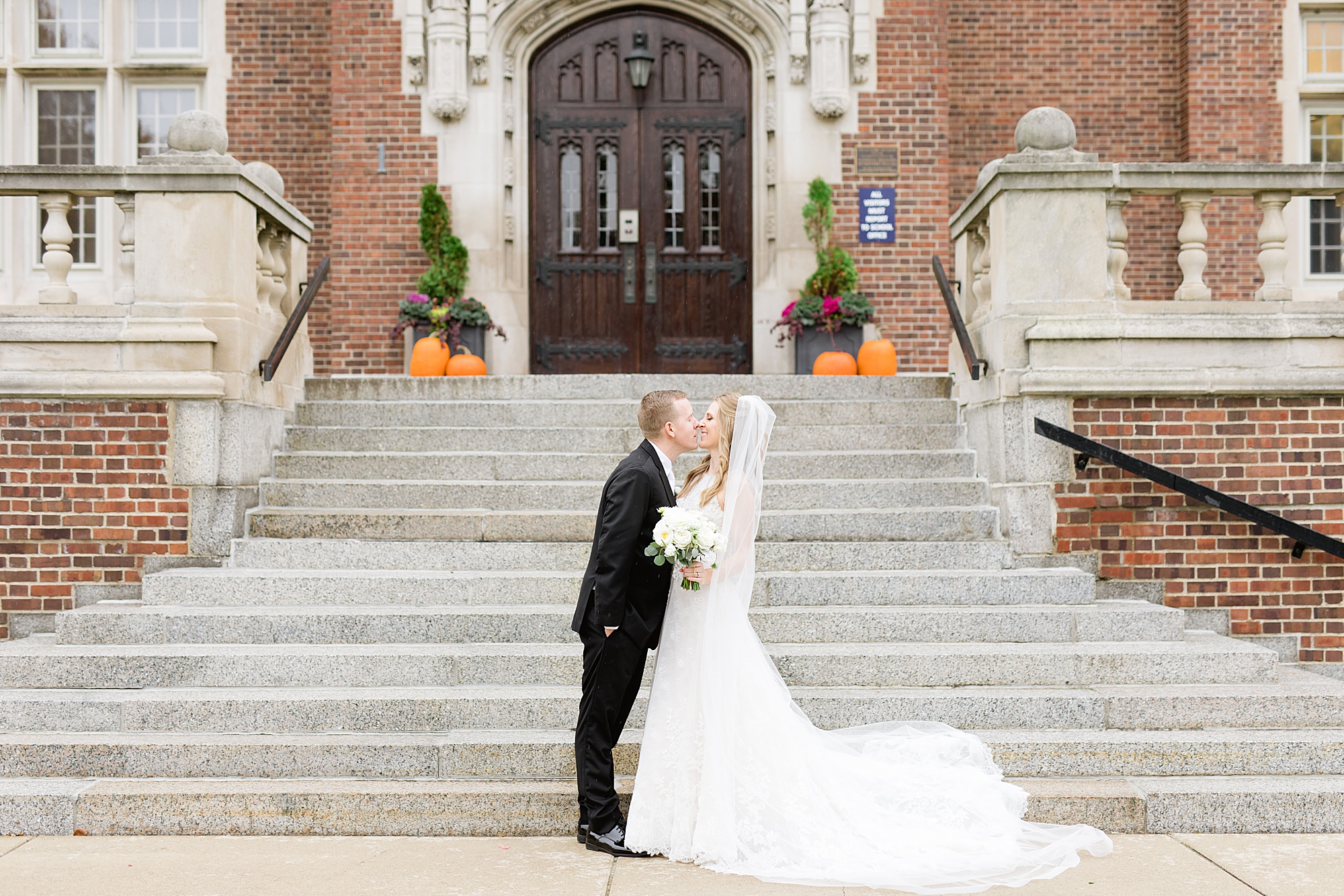 A classic rainy Grosse Pointe War Memorial wedding in late October filled with greenery and roses by Breanne Rochelle Photography.