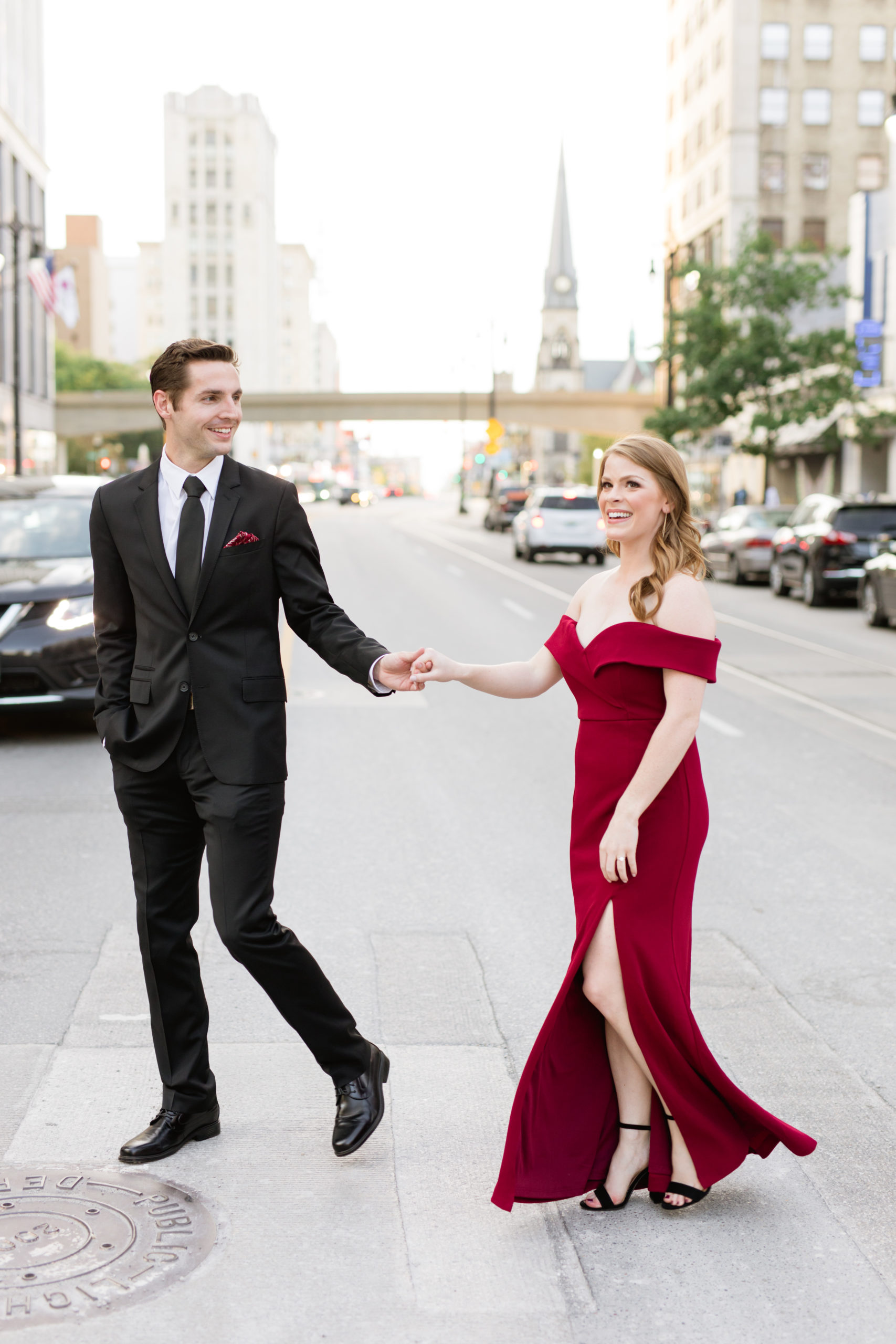 Couple walking in the street for engagement photo | Detroit | Breanne Rochelle Photography
