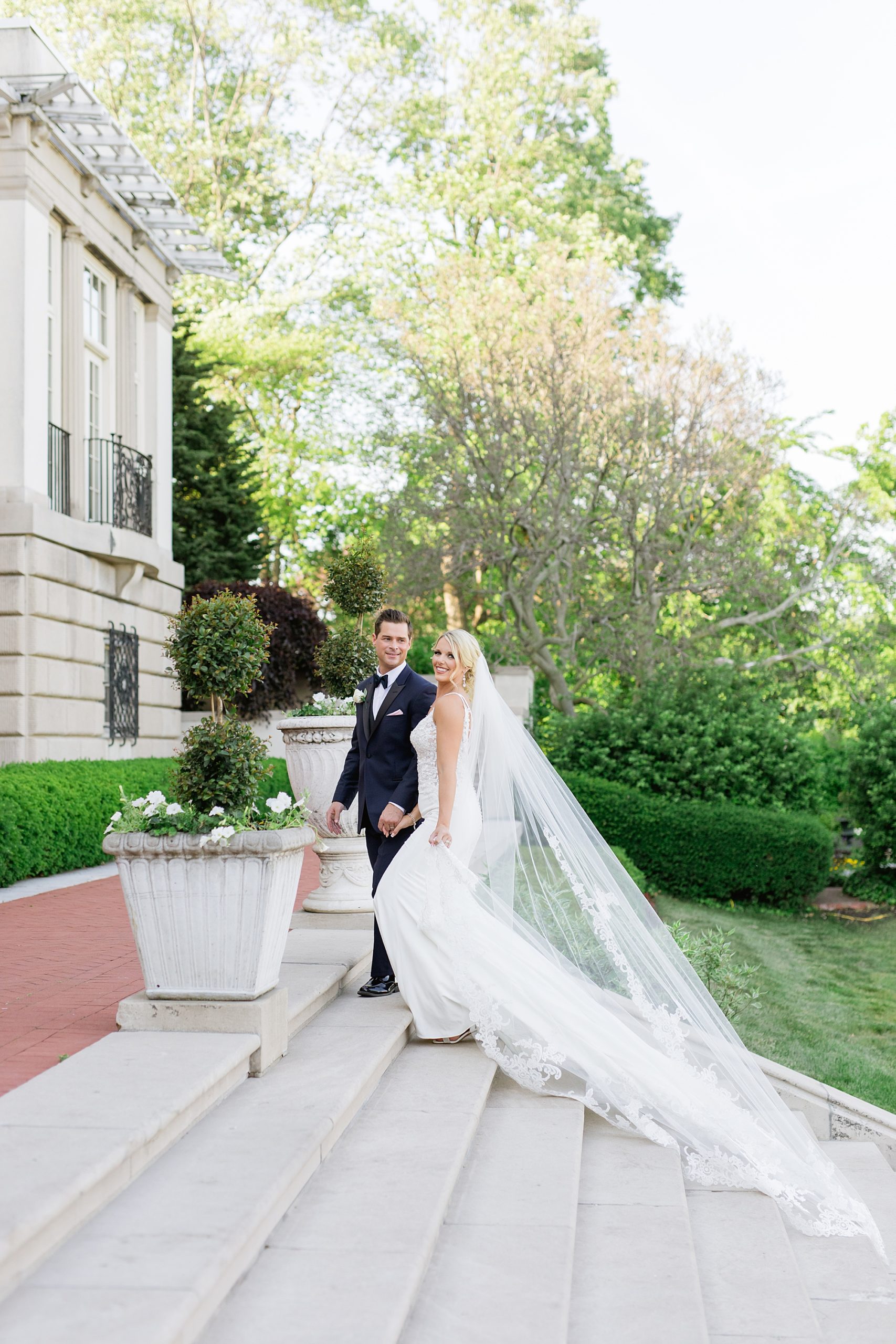 An elegant early summer War Memorial tent wedding in Grosse Pointe, Michigan on the water by Breanne Rochelle Photography.