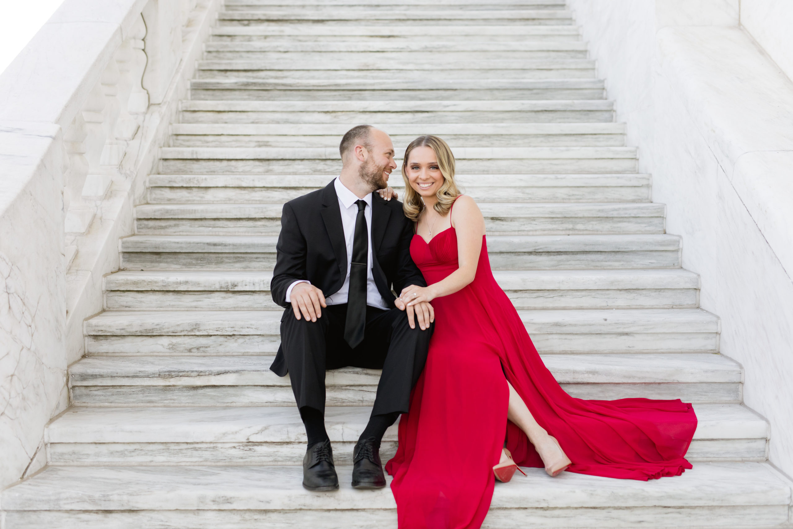 Elegant and classy engagement photos taken on marble staircase