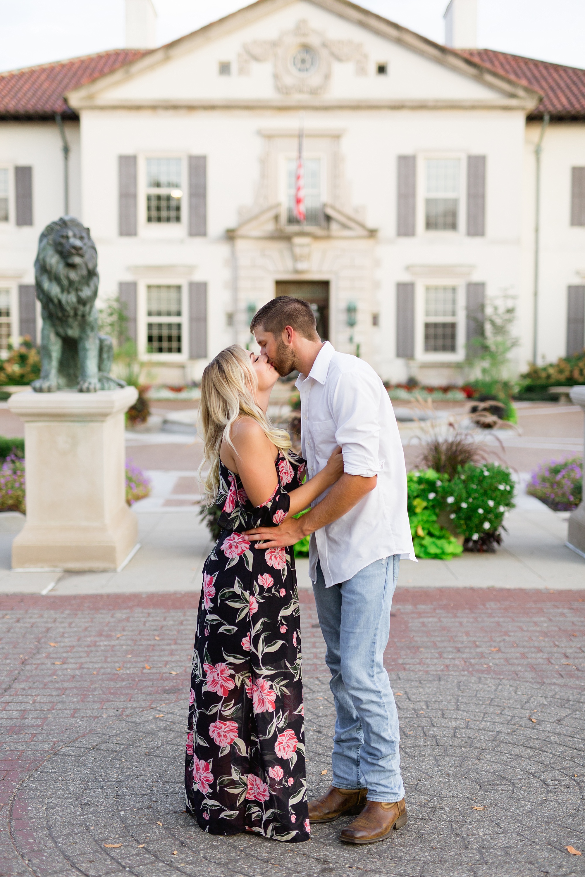 A classic September engagement session filled with blue waters and pretty flowers at The War Grosse Pointe War Memorial by Breanne Rochelle Photography.