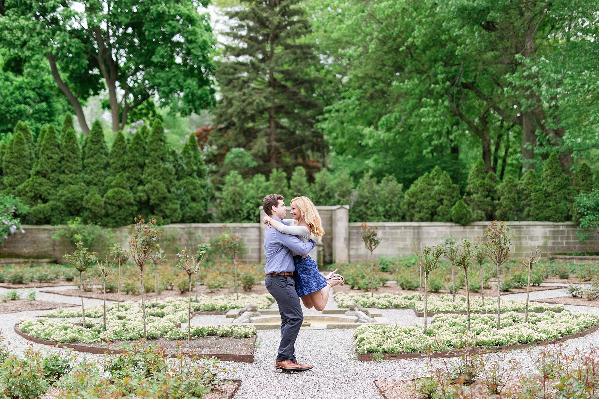 A classic spring engagement session filled with beautiful greenery and white blooms at the Edsel and Eleanor Ford House in Grosse Pointe, Michigan by Breanne Rochelle Photography.