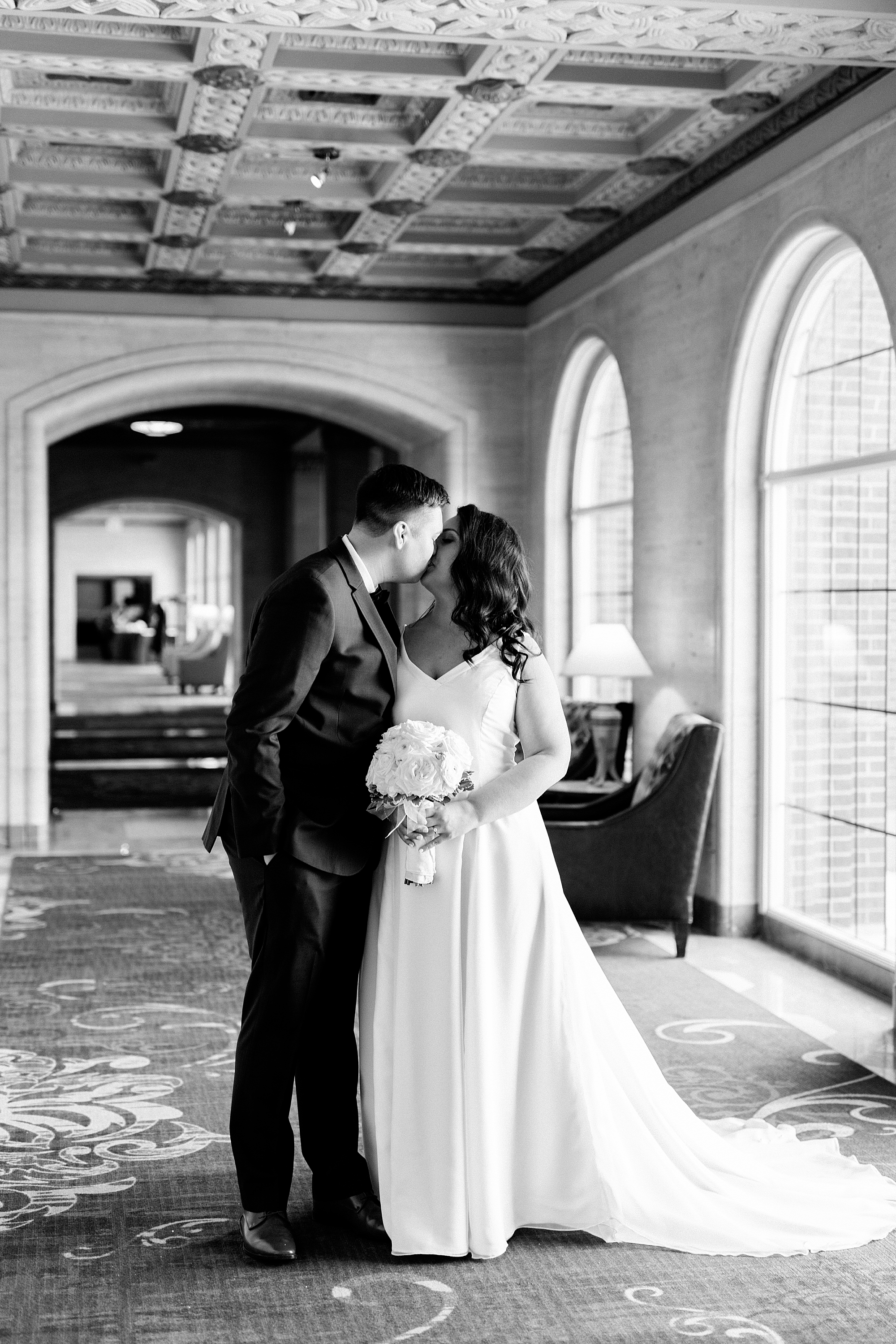 A classic blush and navy winter Inn at St. John's wedding set against a snowy backdrop in Plymouth, Michigan by Breanne Rochelle Photography.
