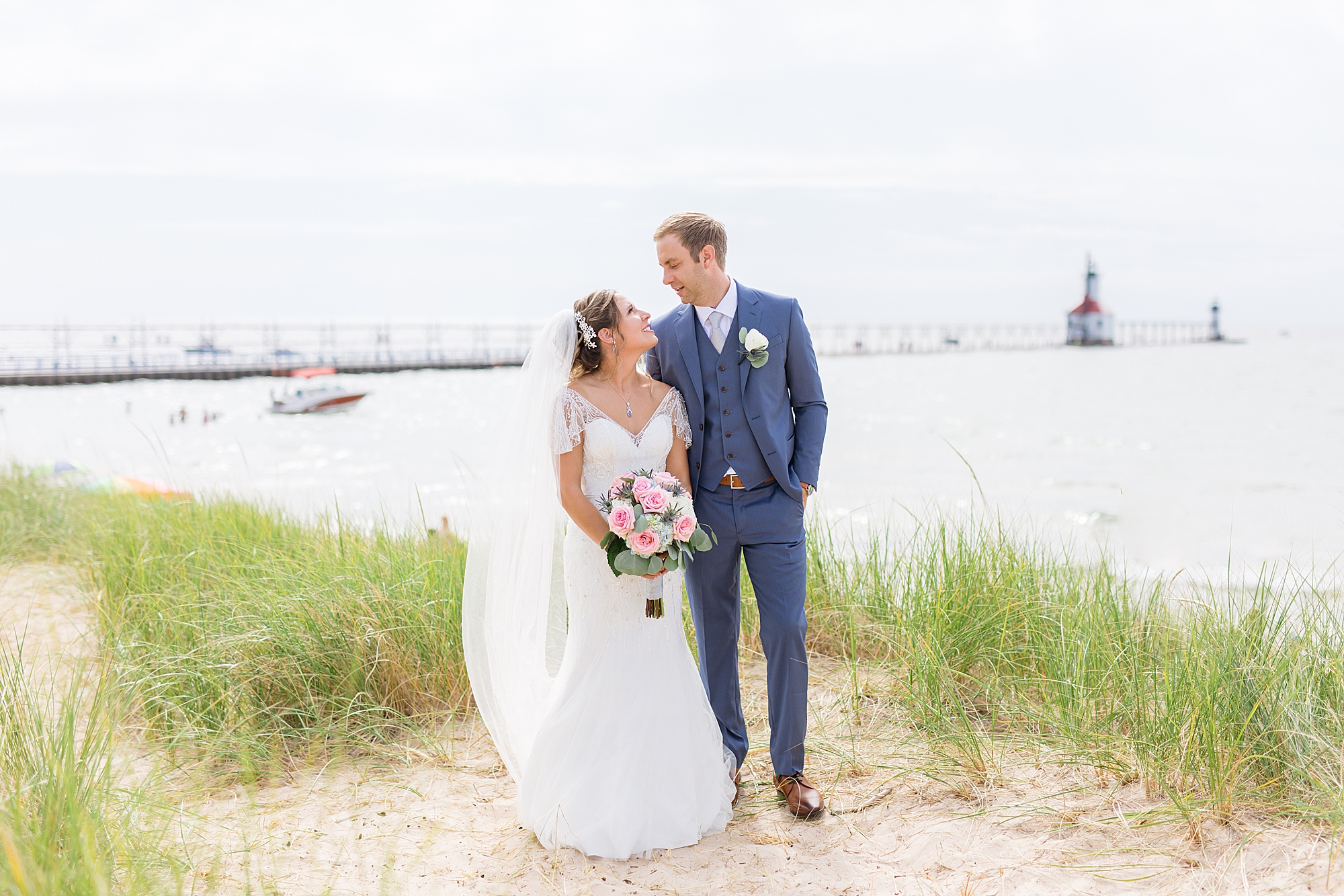 A romantic summer wedding along the blue waters of Lake Michigan at the Inn at Harbor Shores in St. Joseph, Michigan by Breanne Rochelle Photography.